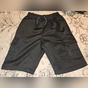 Encrypted boys black cargo shorts.